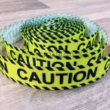 Popruh černo-žlutý CAUTION var.1 / 22 mm